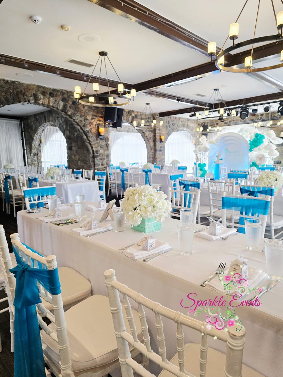 Guest Table Styling, Teal sashes, white wooden chairs