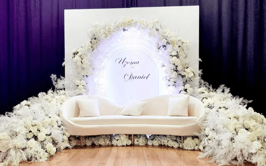 Floral and drape wedding backdrop built by Sparkle Events