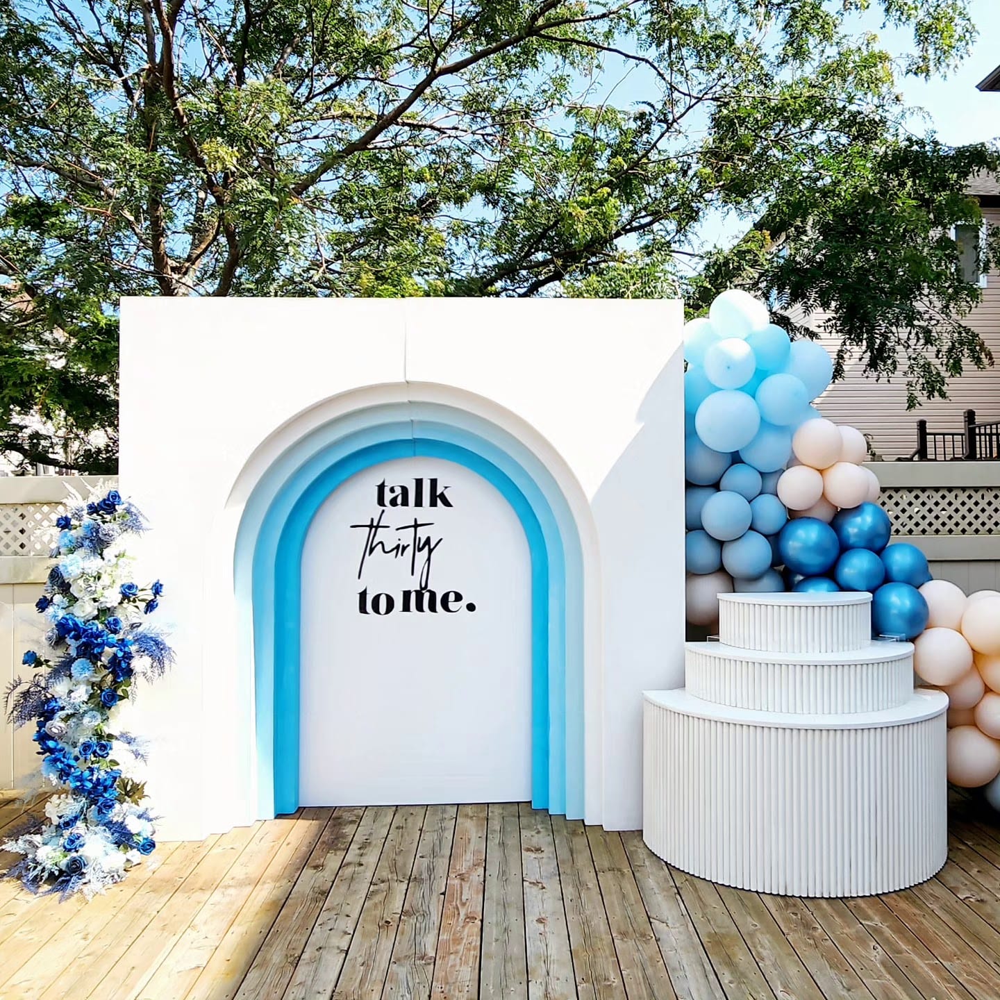 Blue Layered Arch Backdrop And Tiered Table