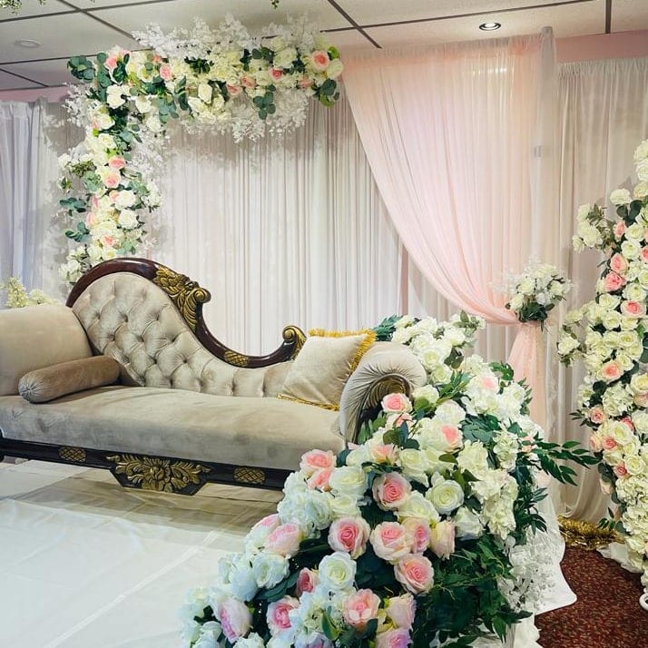 Tufted Chaise Under Floral Arch